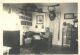BURT, Peter Hutchison (1847-1939)- Pictured in his home when living in Hill City, Aitkin, MN, USA.  Spouse: Anna Eliza DAVIS (1855-1909). Notice Anna's picture on the wall above his couch and all the books on the wall shelves.